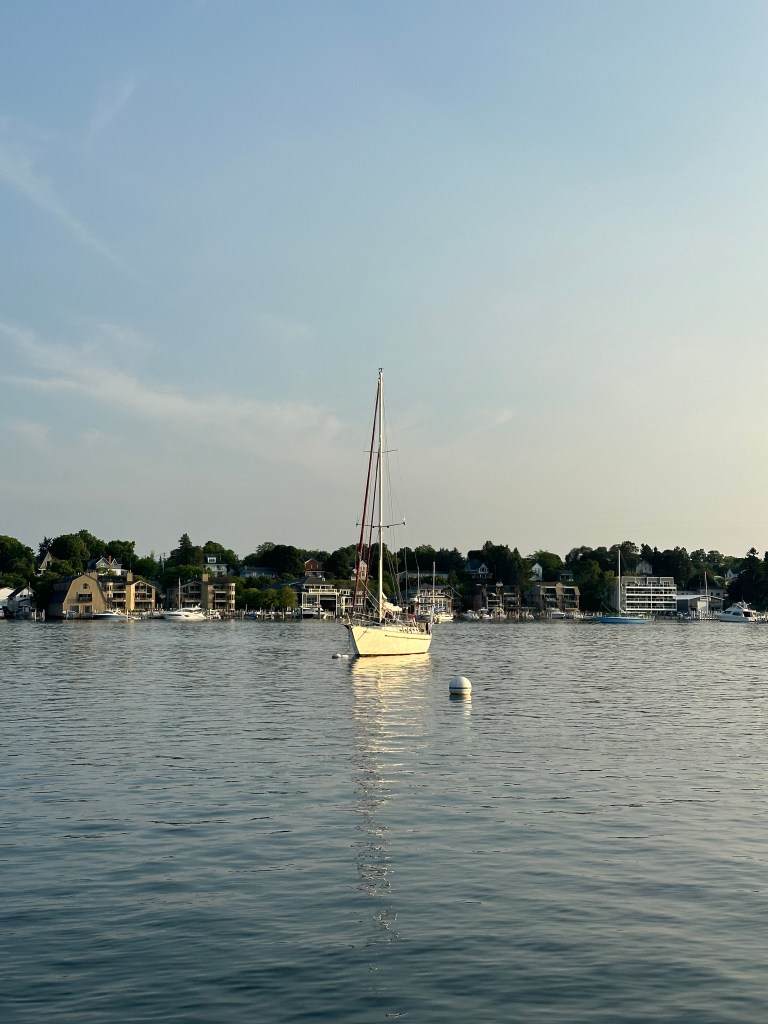 SV Red Pill, chilling on Round Lake during Charlevoix Venetian Festival.